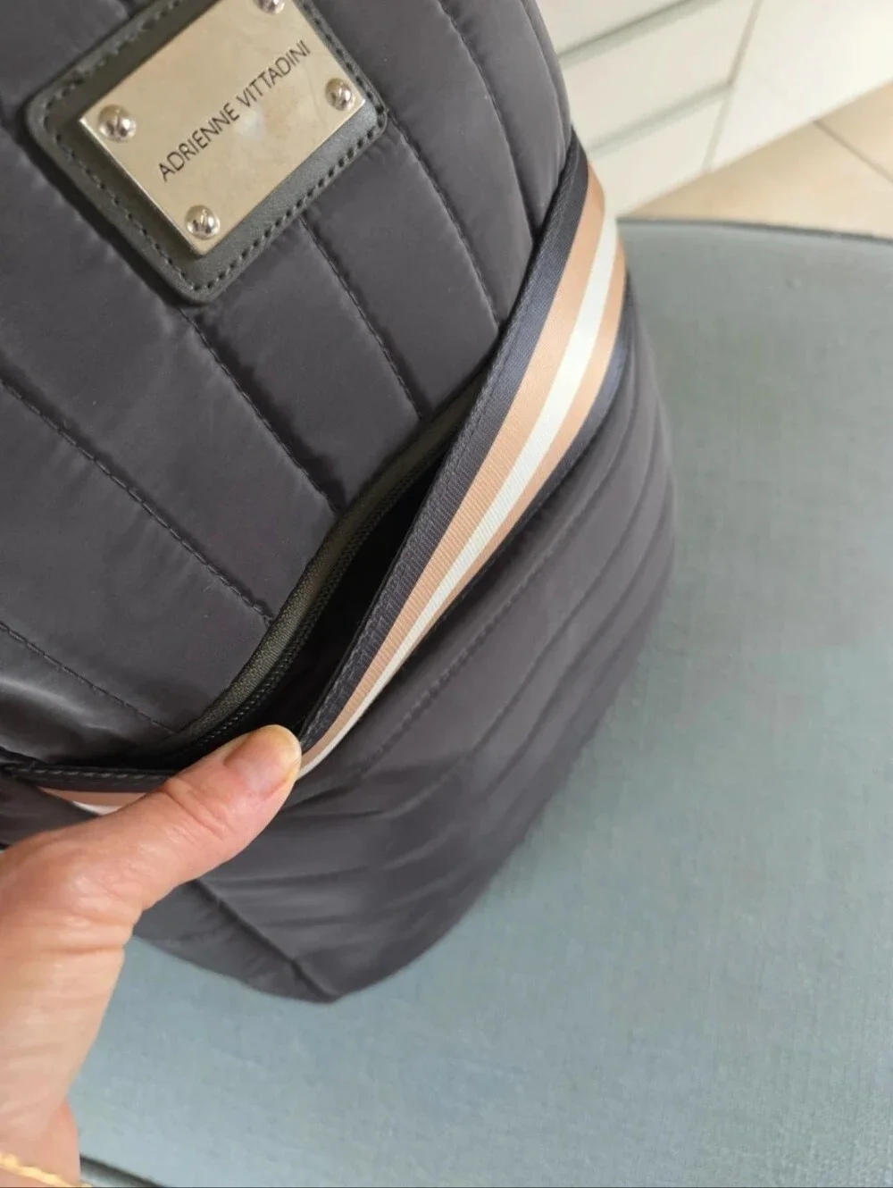 Quilted, Sleek, boxy, Gray Nylon Backpack with Pink-Tan Stripe.